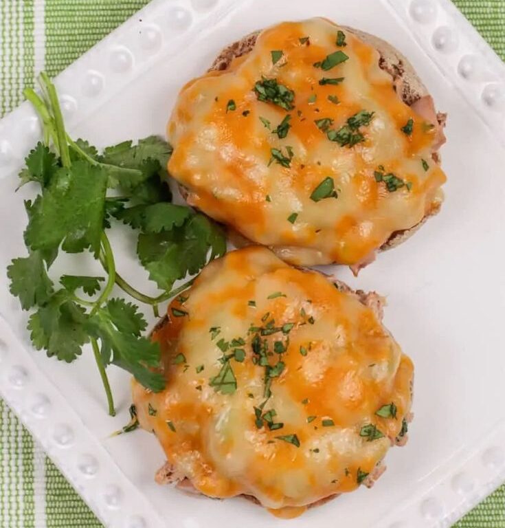English muffin tuna melts on bright red tray Air Fryer English Muffin Tuna Melt